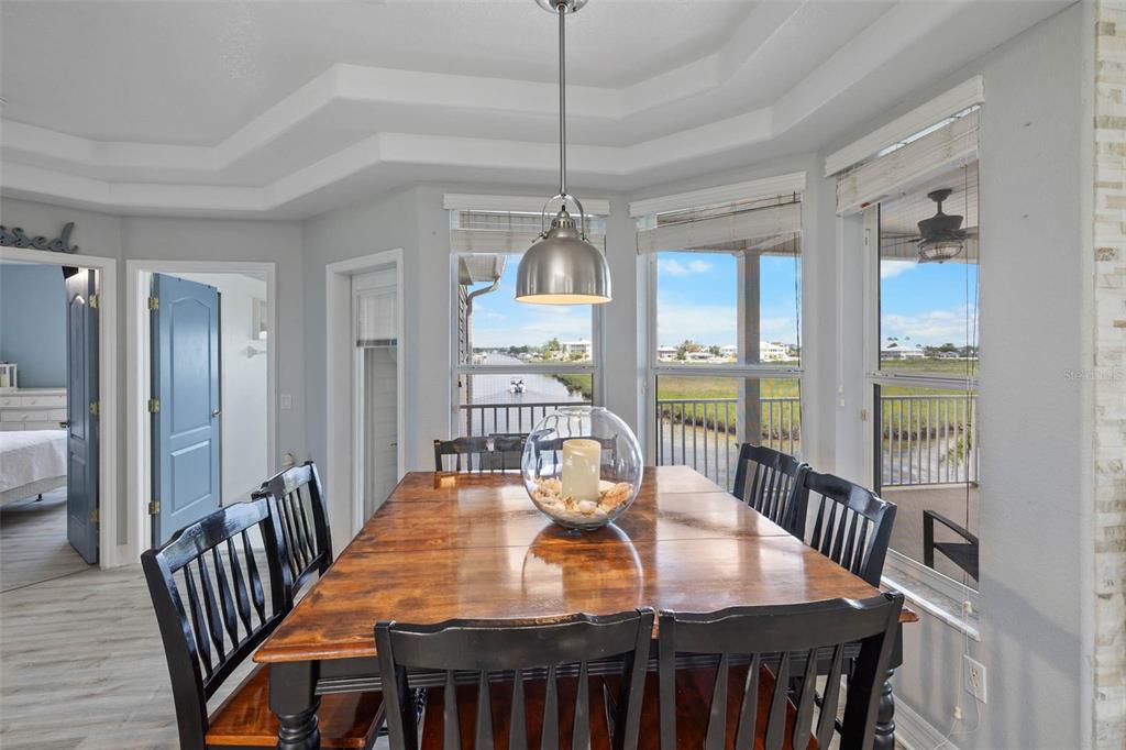 3280 Gulf Winds Circle Hernando Beach, FL 34607 - Photo 19 of 68 a view of a dining room with furniture window and wooden floor