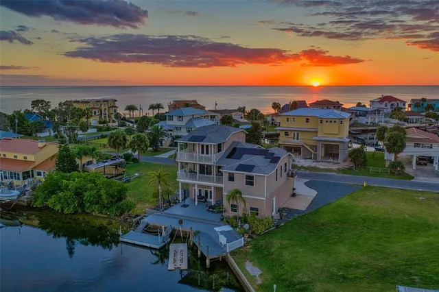 an aerial view of a house with a ocean view