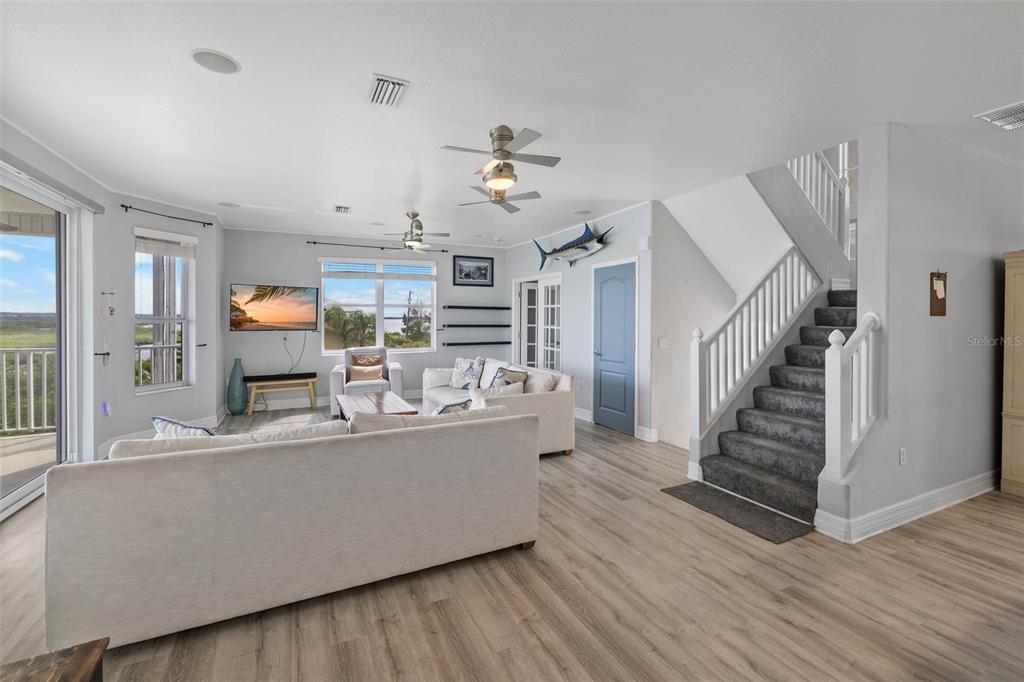 3280 Gulf Winds Circle Hernando Beach, FL 34607 - Photo 22 of 68 a view of a living room and kitchen with wooden floor