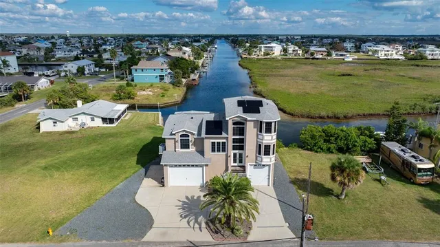 an aerial view of a house with outdoor space