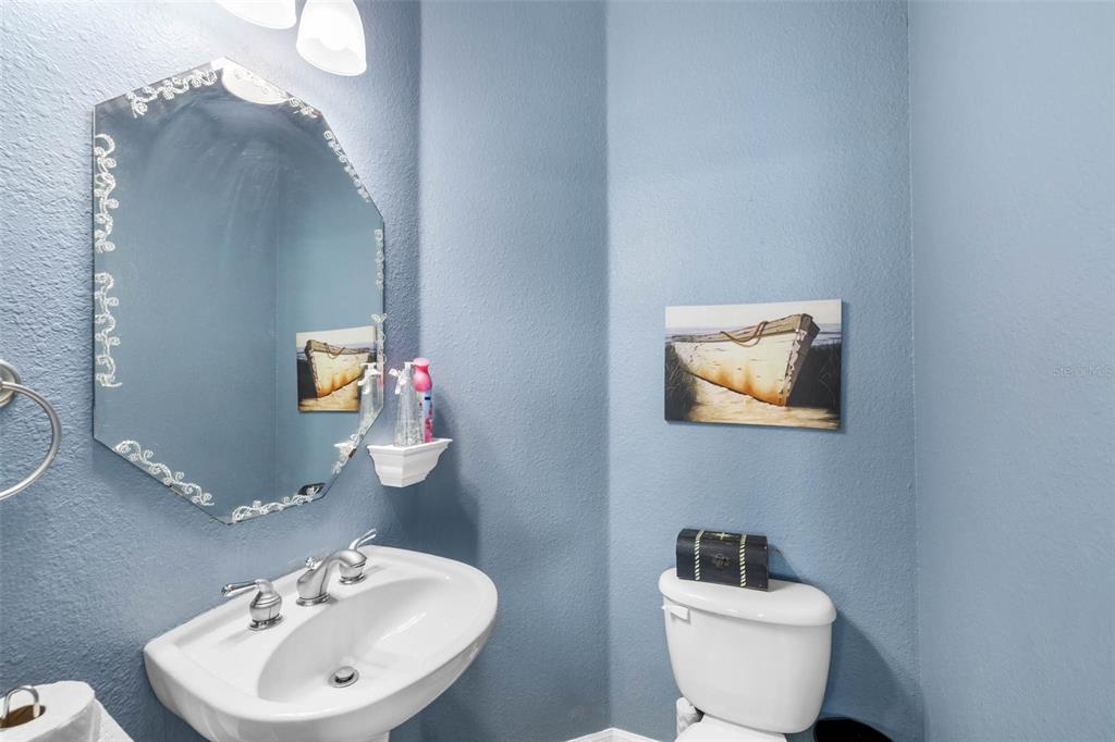 3280 Gulf Winds Circle Hernando Beach, FL 34607 - Photo 31 of 68 a bathroom with a toilet sink and mirror