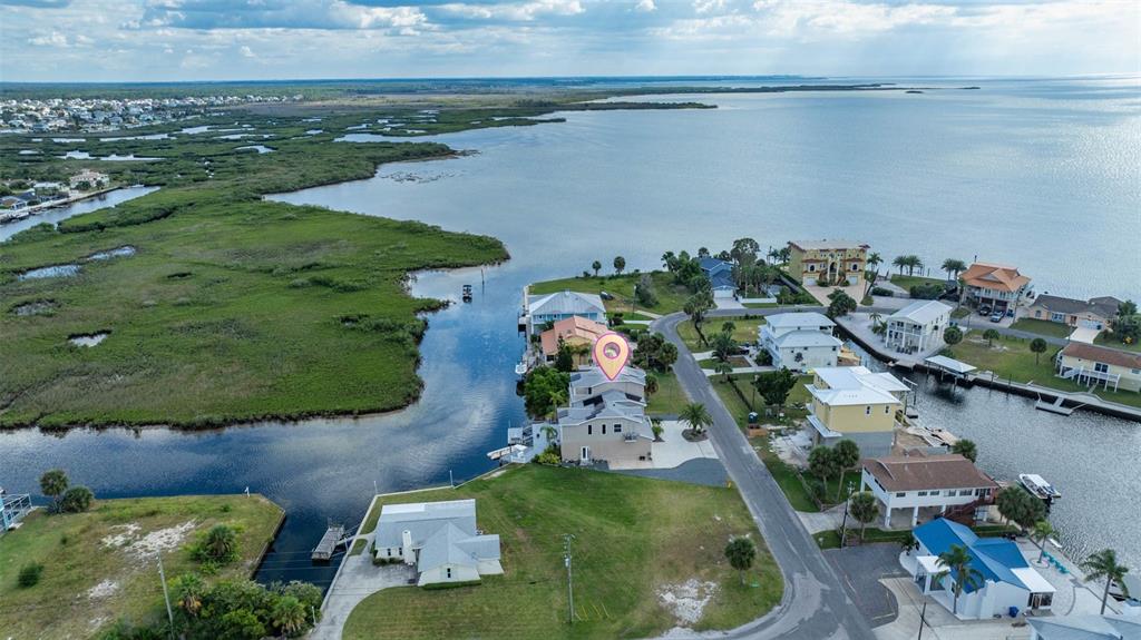 3280 Gulf Winds Circle Hernando Beach, FL 34607 - Photo 7 of 68 an aerial view of a houses with outdoor space