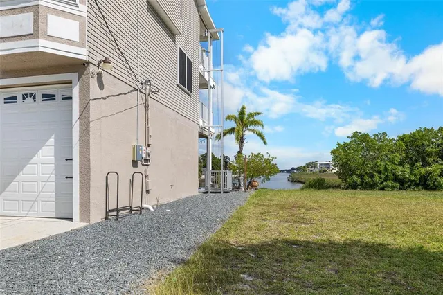 a dining room with furniture a chandelier and wooden floor