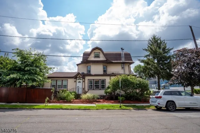a view of multiple houses with a yard