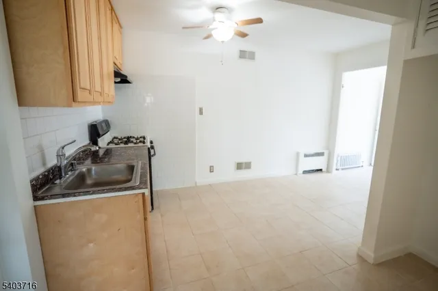 a kitchen with a sink and cabinets
