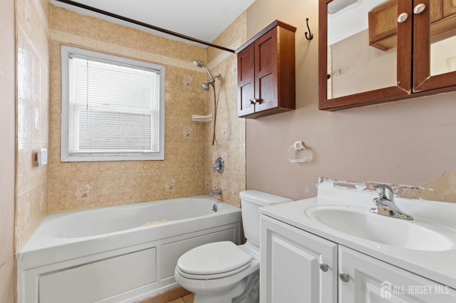 6 Cherry Street Edison, NJ 08817 - Photo 17 of 30 a bathroom with a sink a toilet and a bathtub