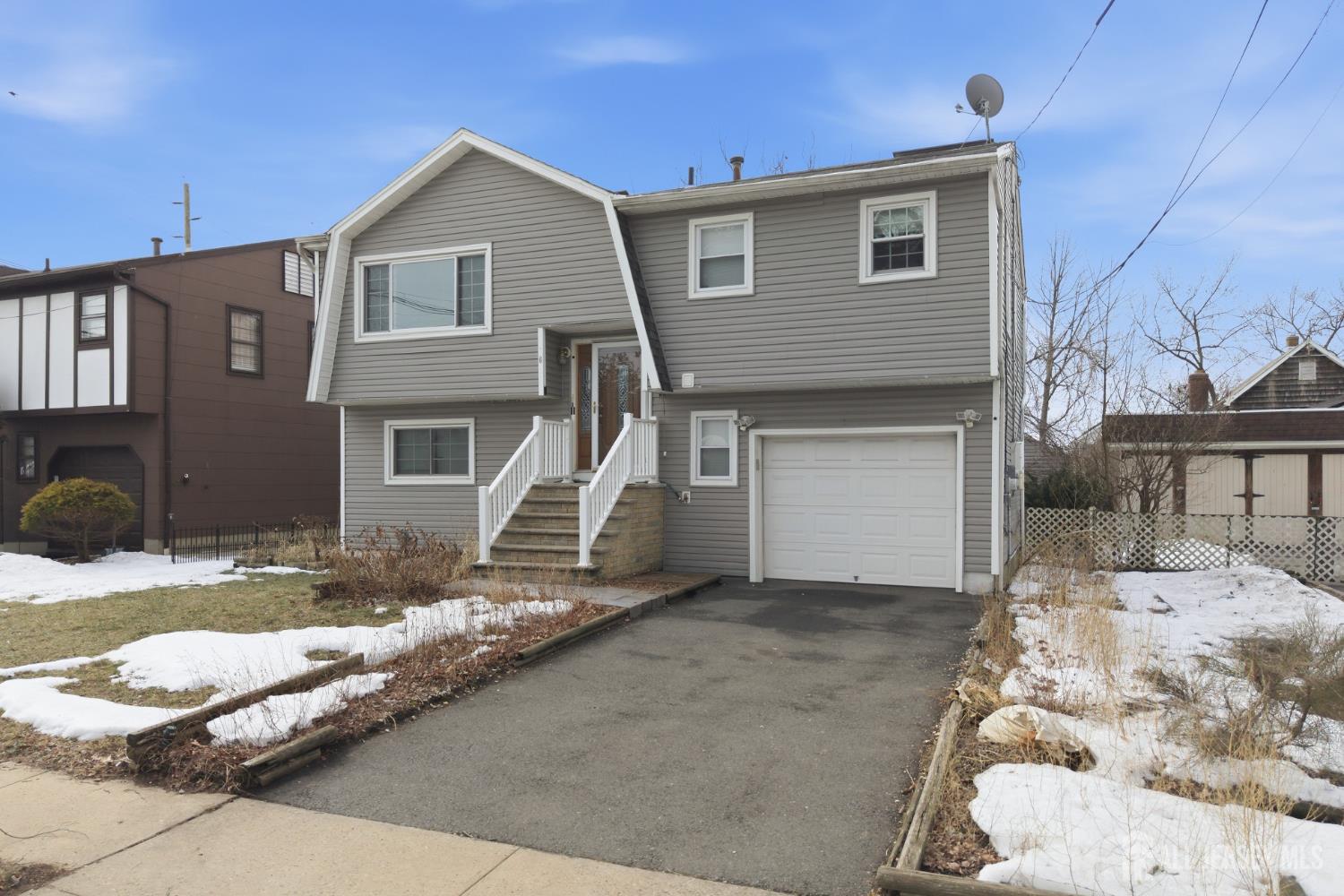 6 Cherry Street Edison, NJ 08817 - Photo 2 of 30 a front view of a house with a yard