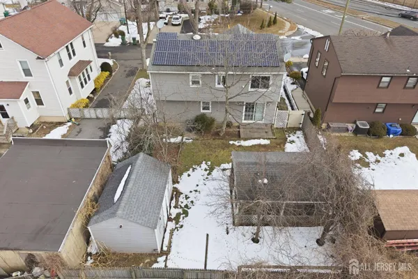 an aerial view of a residential apartment building with a yard