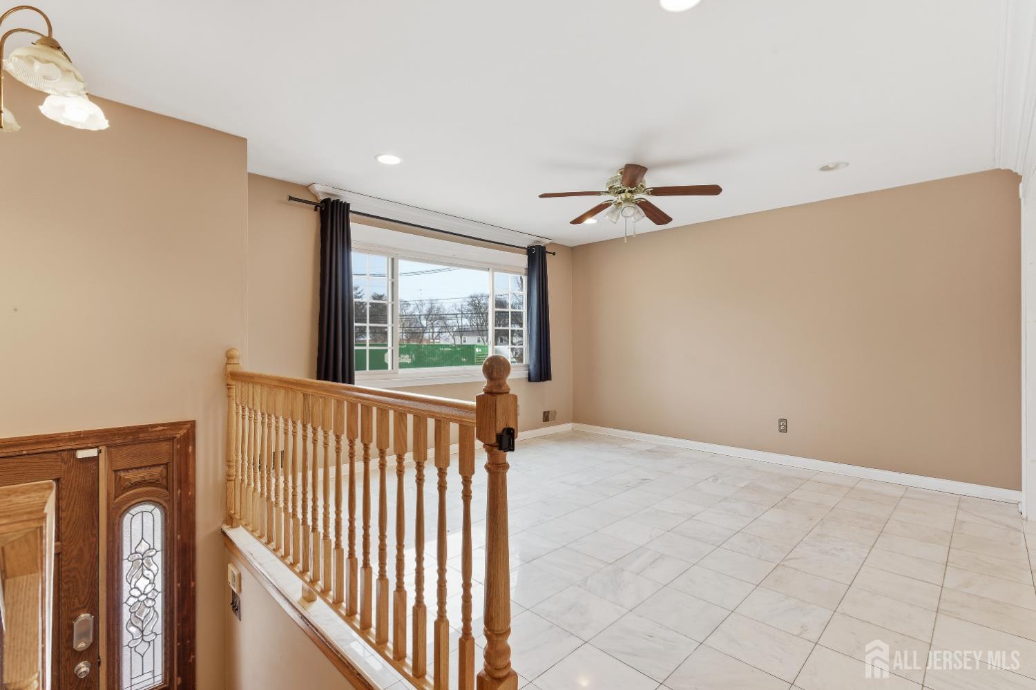 6 Cherry Street Edison, NJ 08817 - Photo 3 of 30 a view of a hallway with a ceiling fan