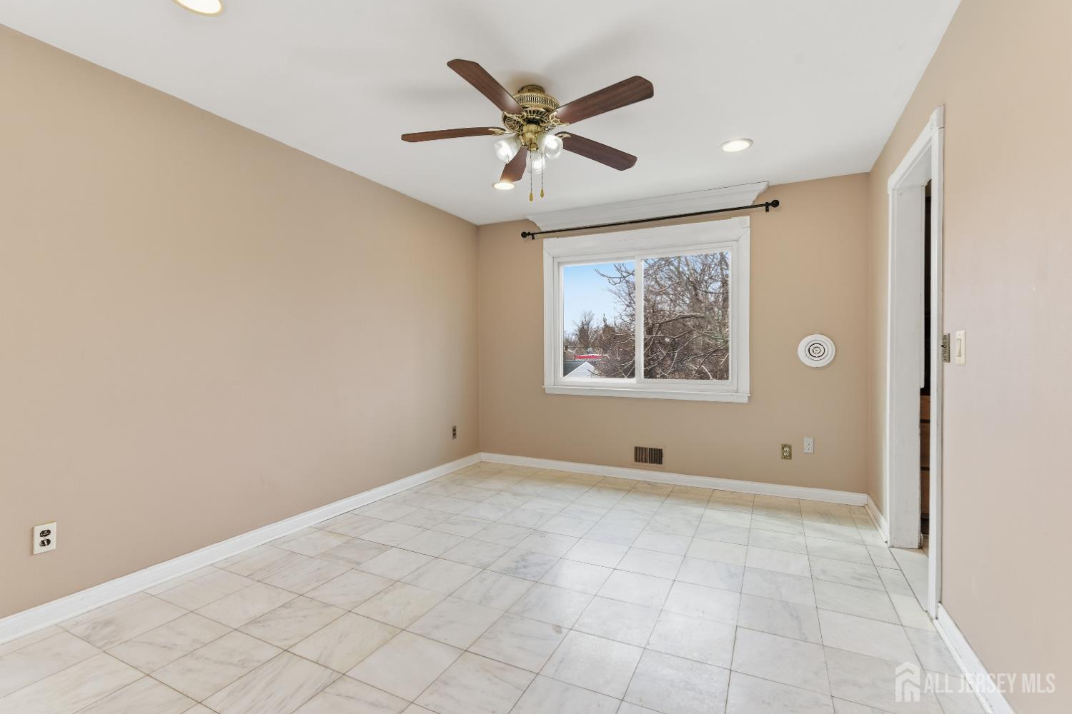 6 Cherry Street Edison, NJ 08817 - Photo 10 of 30 a view of an empty room with a window