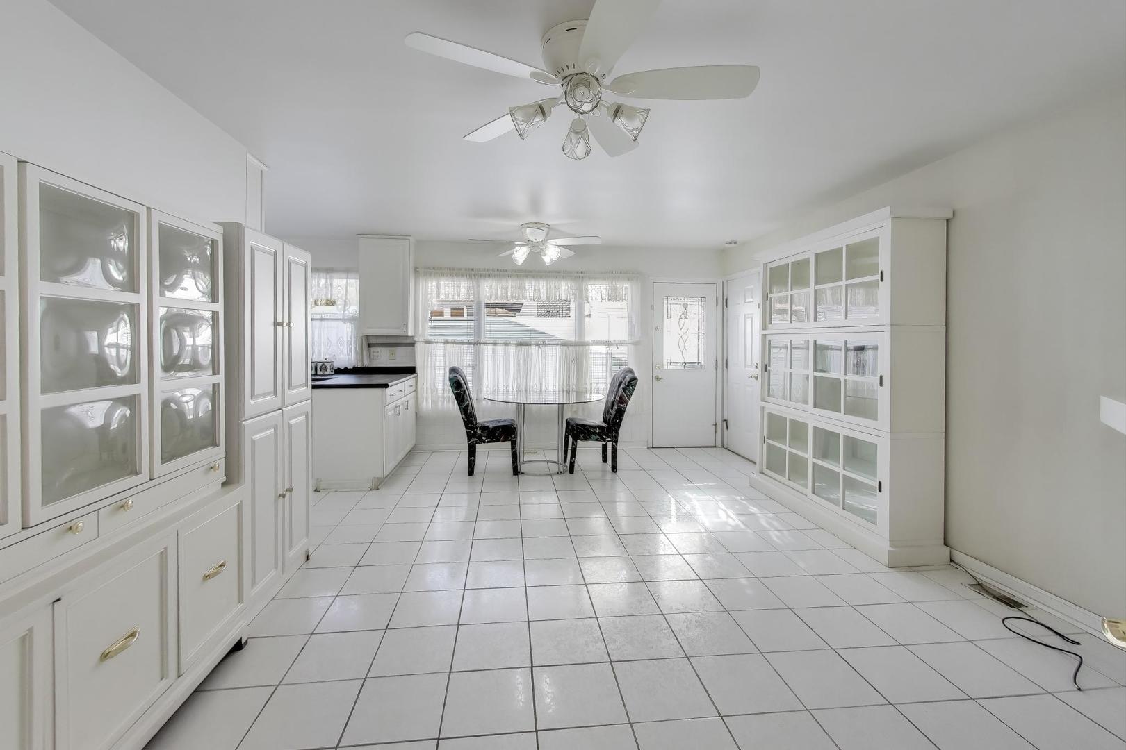 121 South Lancaster Drive Bolingbrook, IL 60440 - Photo 11 of 35 a view of a dining room with furniture and chandelier