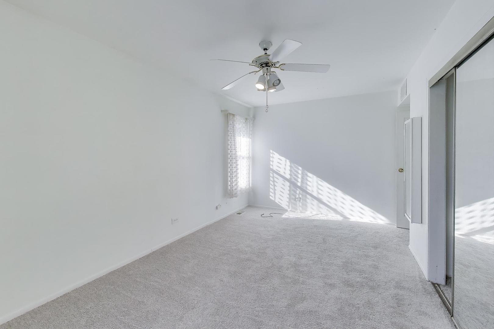 121 South Lancaster Drive Bolingbrook, IL 60440 - Photo 19 of 35 a view of an empty room with a window