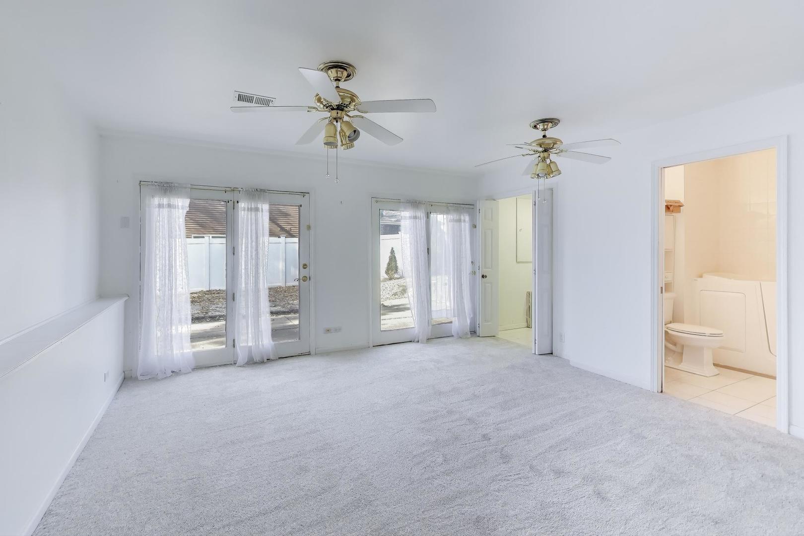 121 South Lancaster Drive Bolingbrook, IL 60440 - Photo 22 of 35 a view of an empty room with a window