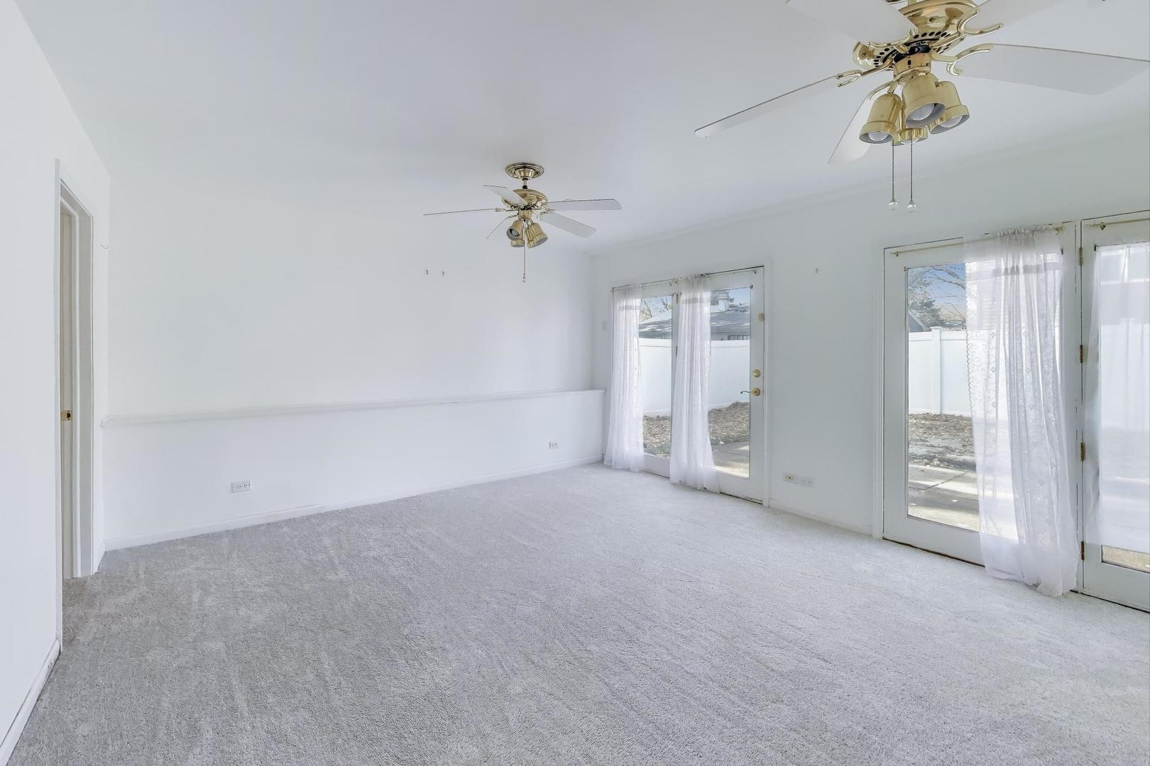 121 South Lancaster Drive Bolingbrook, IL 60440 - Photo 23 of 35 an empty room with a empty space and a ceiling fan