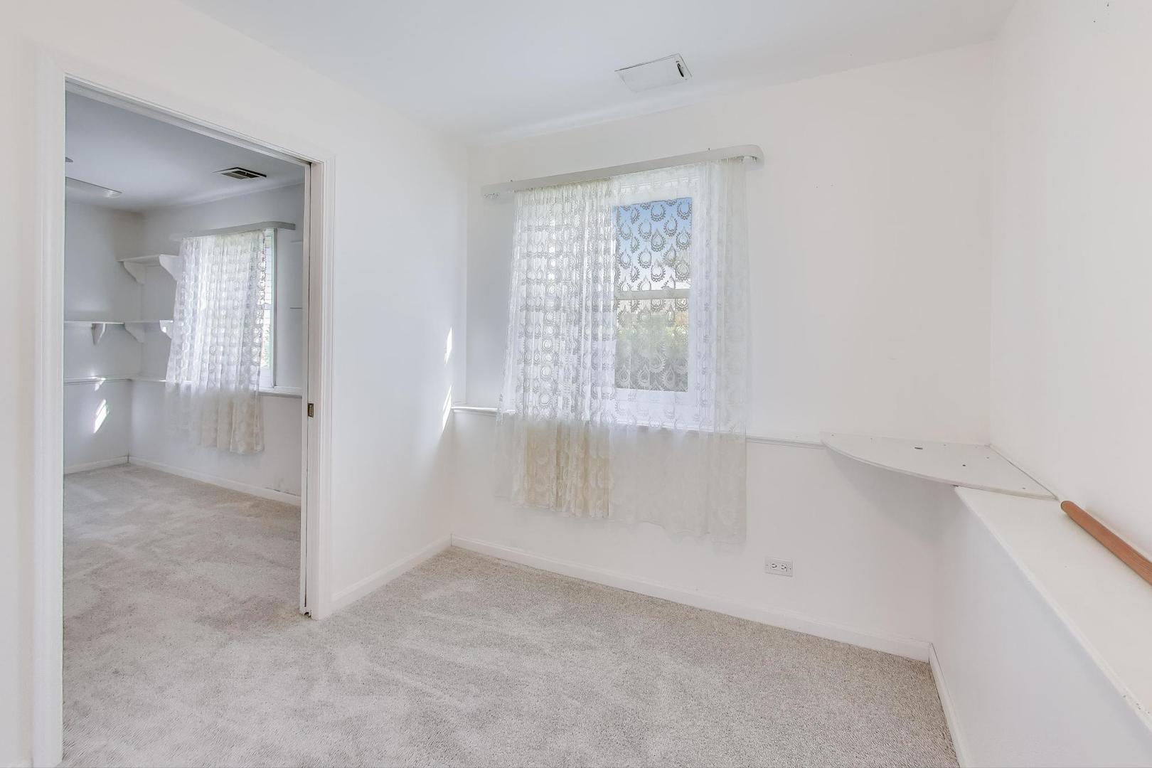 121 South Lancaster Drive Bolingbrook, IL 60440 - Photo 27 of 35 a view of an empty room with a window