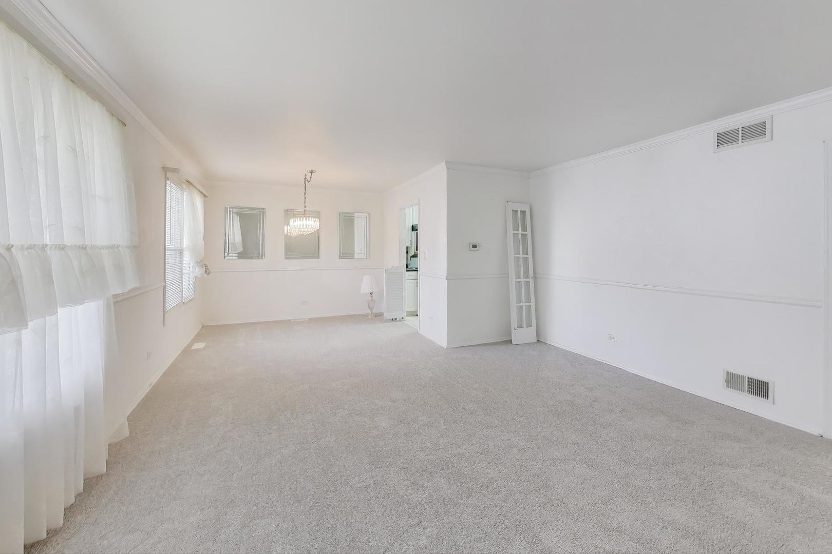 121 South Lancaster Drive Bolingbrook, IL 60440 - Photo 5 of 35 a view of an empty room with a window