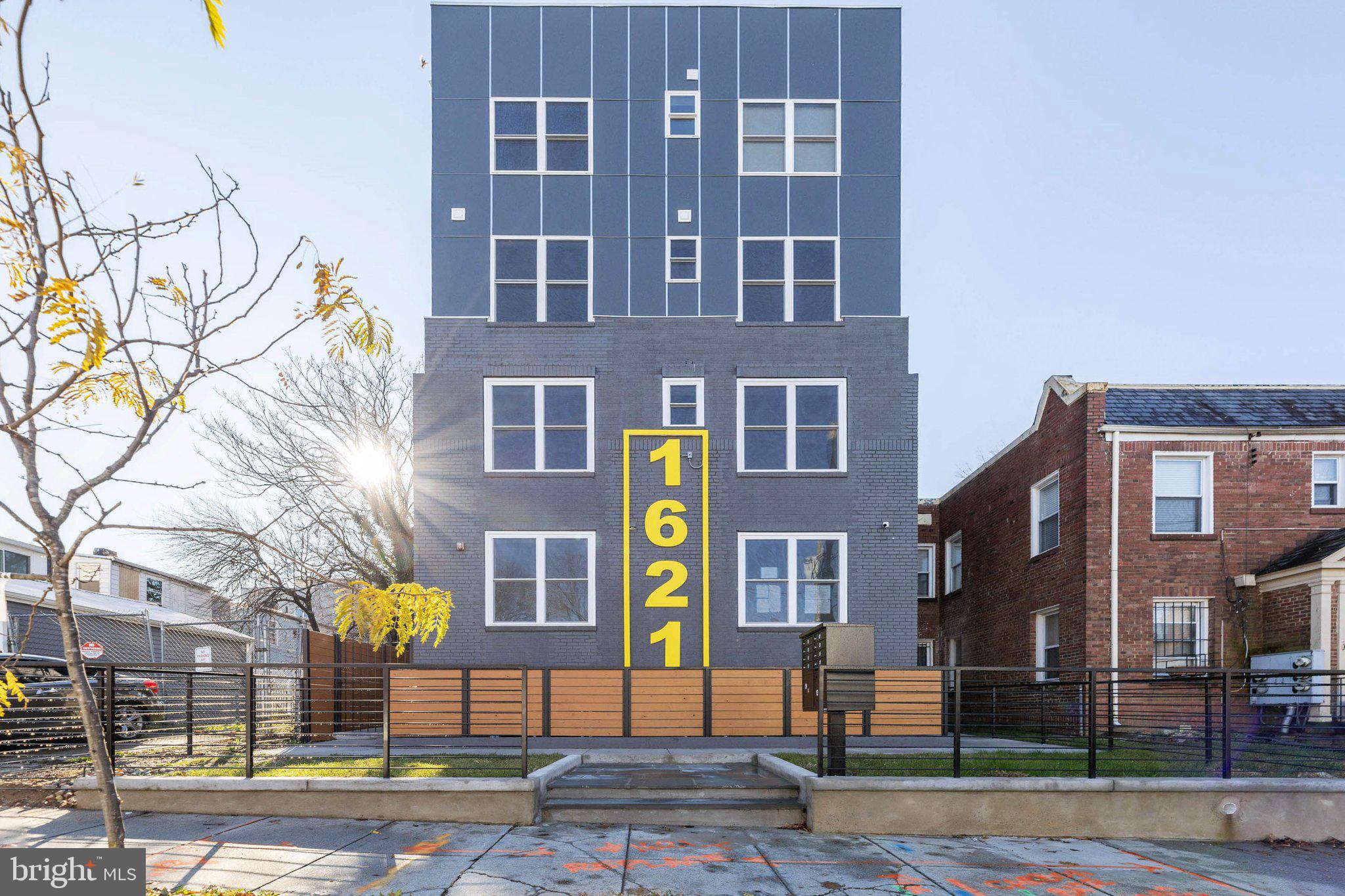 1621 T Street Southeast, Unit 8 Washington, DC 20020 - Photo 1 of 8 a front view of a multi story building