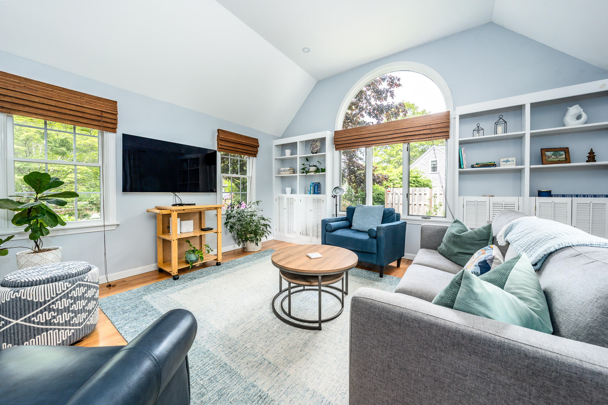 61 Angus Way Centerville, MA 02632 - Photo 22 of 59 a living room with furniture a flat screen tv and a large window