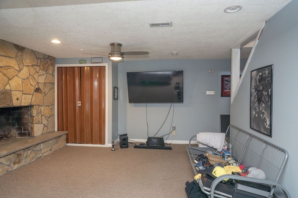 77 Morrison Road East Taunton, MA 02718 - Photo 32 of 35 a view of a livingroom with furniture and a flat screen tv