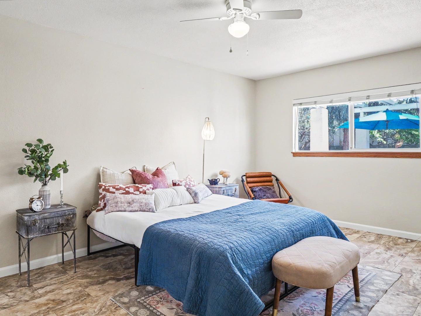 6455 Kensington Place Gilroy, CA 95020 - Photo 16 of 32 a bedroom with beds and a chandelier