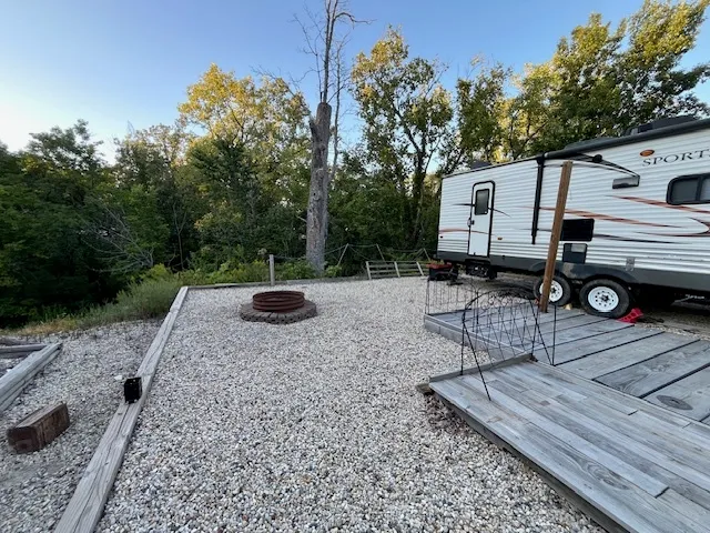 a kitchen with stainless steel appliances granite countertop a sink and wooden cabinets