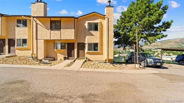 a view of a backyard with sitting area