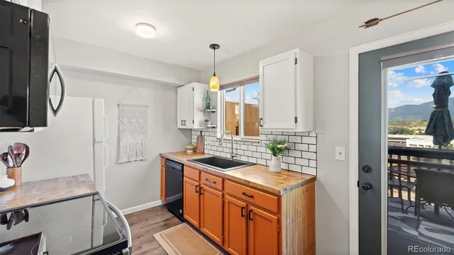 a view of a chair and tables in the balcony