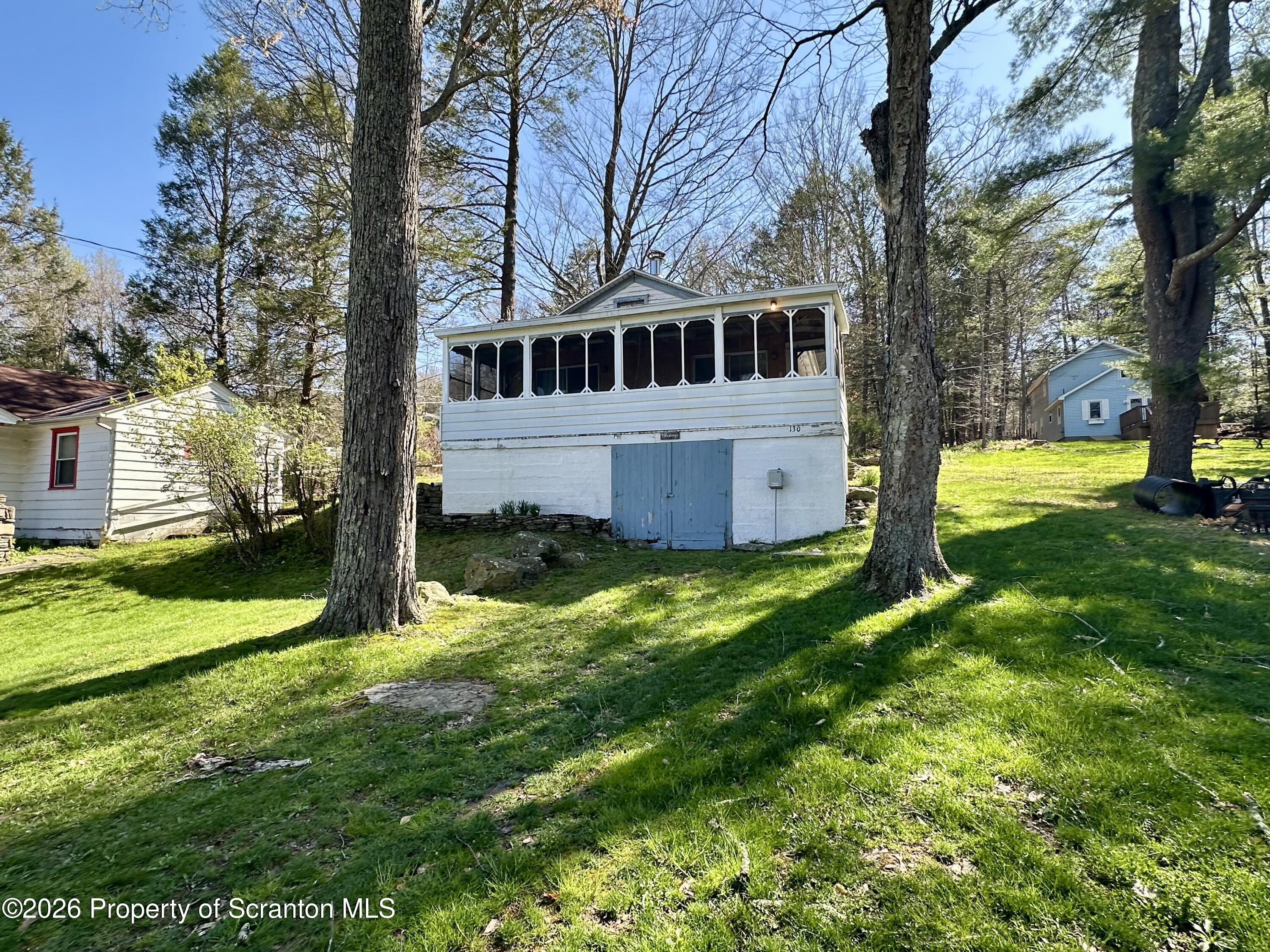 130 1st Street Tunkhannock, PA 18657 - Photo 1 of 23 a view of a house with a yard