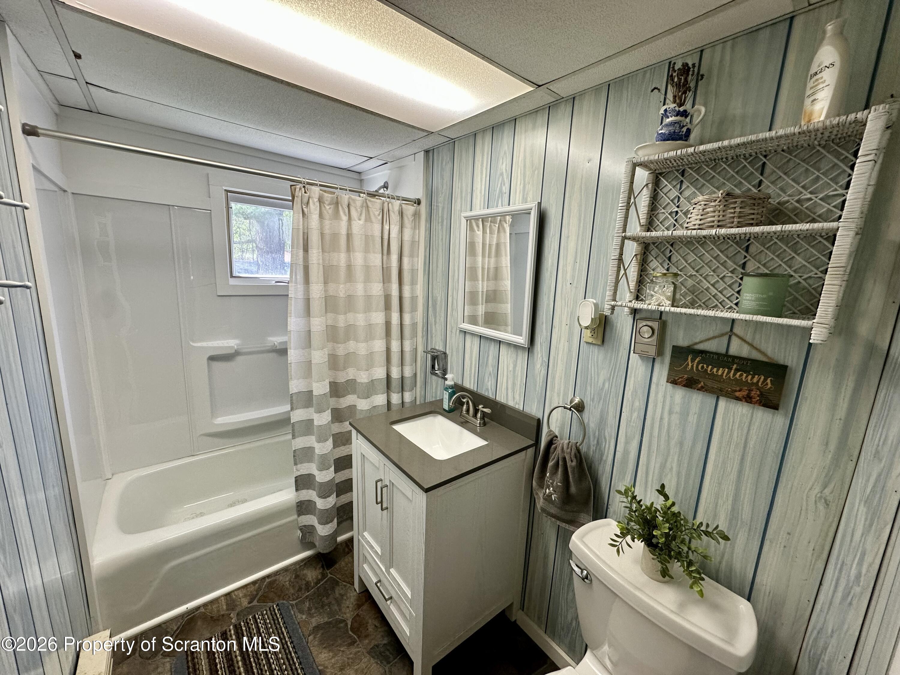 130 1st Street Tunkhannock, PA 18657 - Photo 15 of 23 a bathroom with a granite countertop sink a toilet and shower