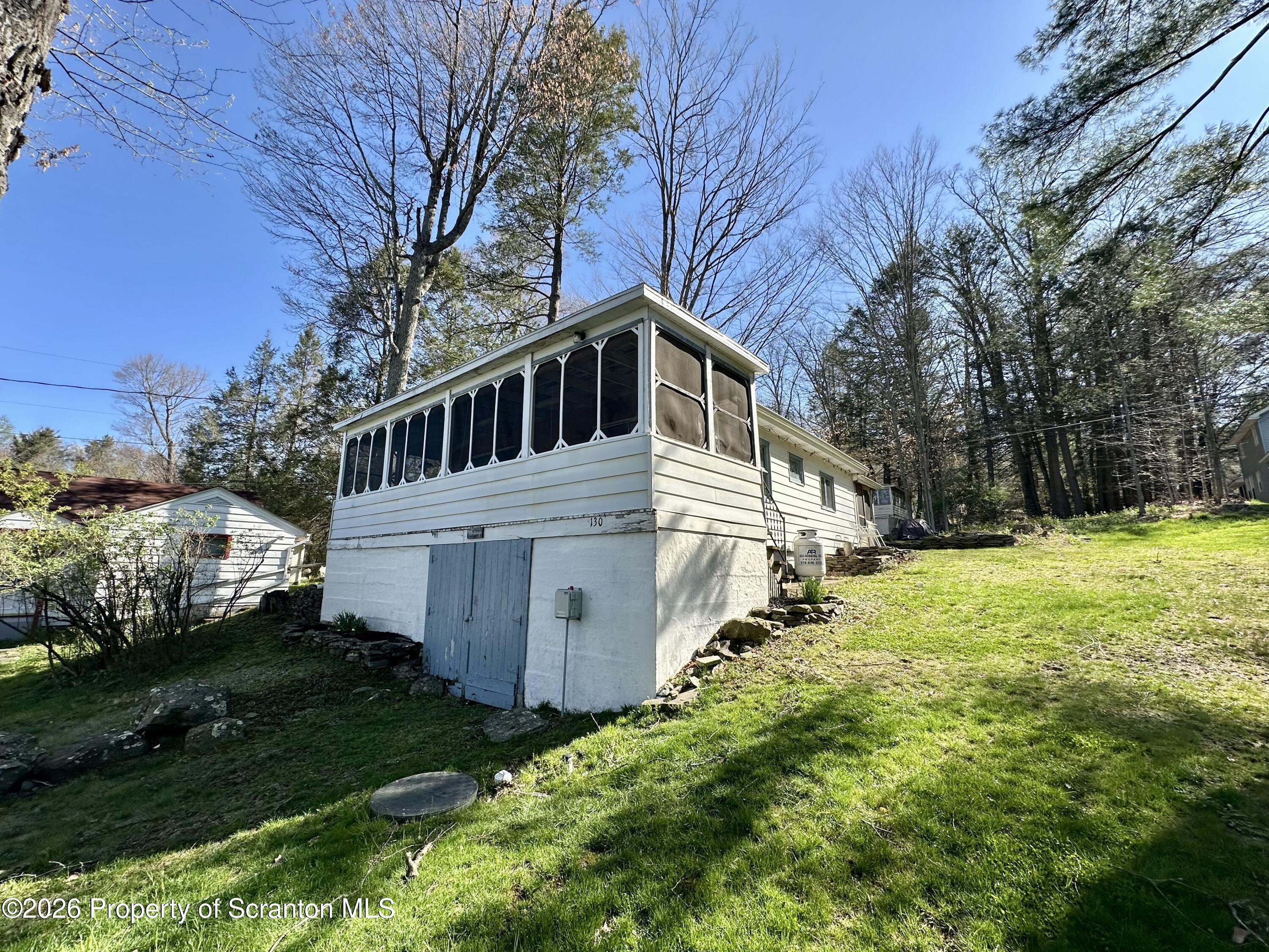 130 1st Street Tunkhannock, PA 18657 - Photo 2 of 23 a front view of a house with a yard