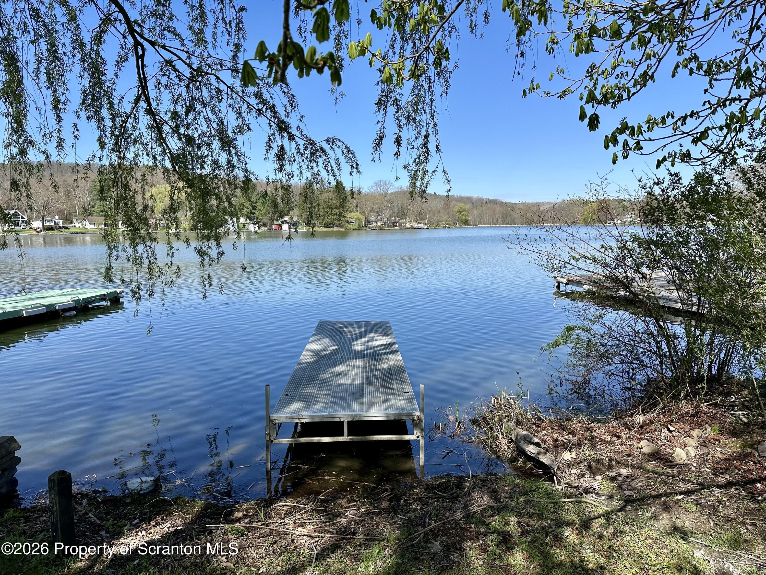 130 1st Street Tunkhannock, PA 18657 - Photo 22 of 23 a view of a lake from a yard