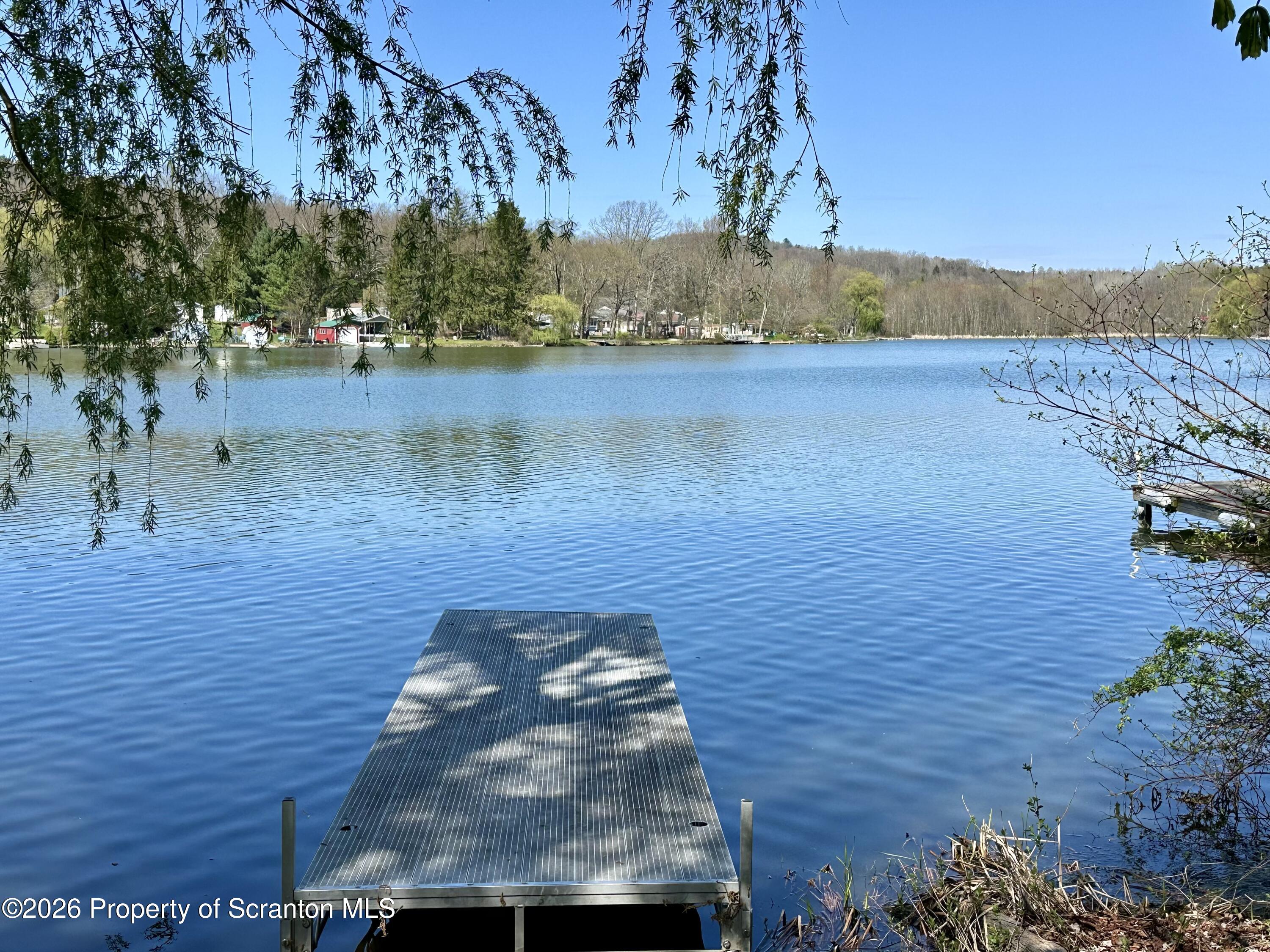 130 1st Street Tunkhannock, PA 18657 - Photo 23 of 23 a view of a lake with a mountain in the background