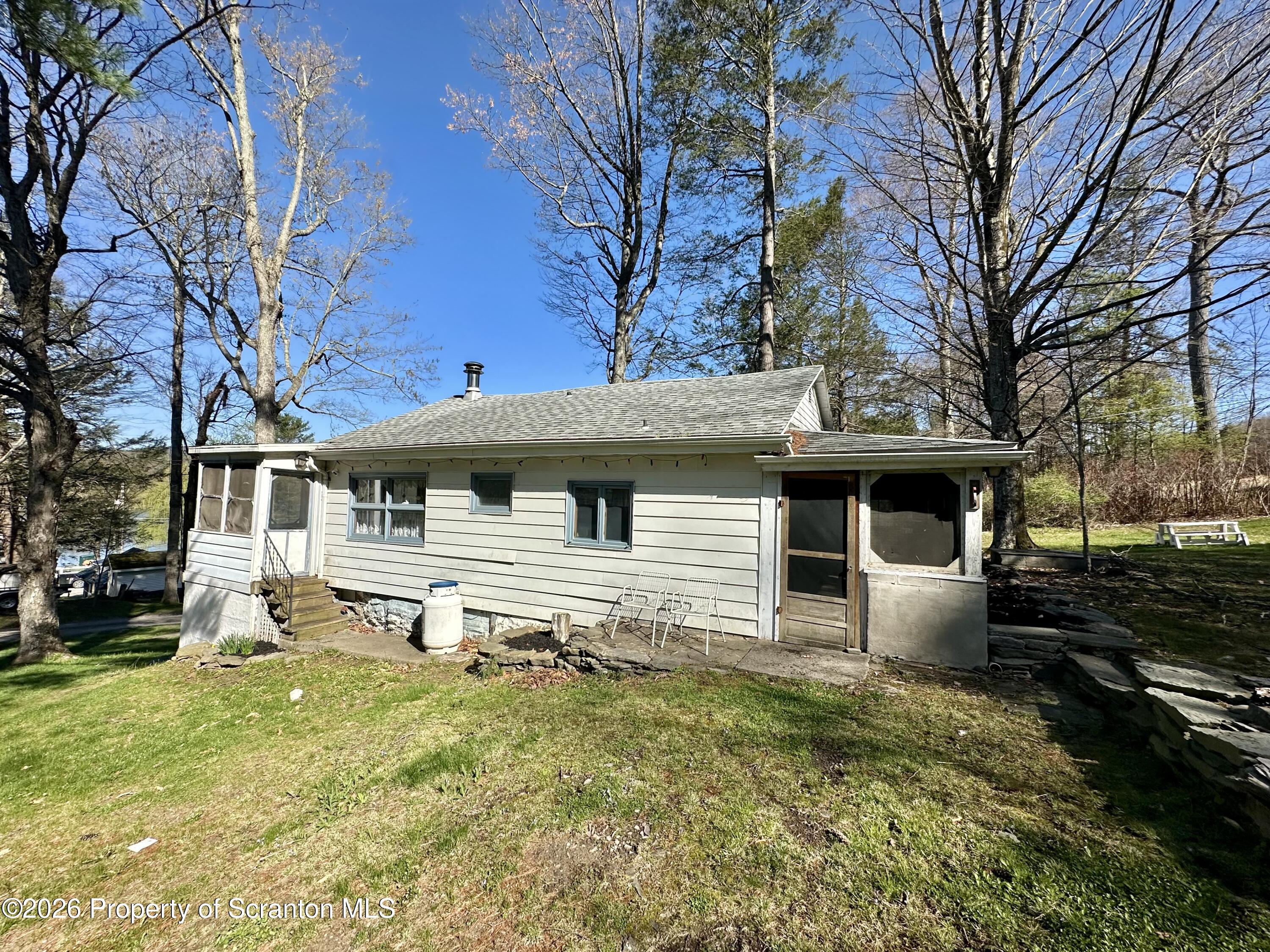 130 1st Street Tunkhannock, PA 18657 - Photo 3 of 23 a front view of a house with a yard