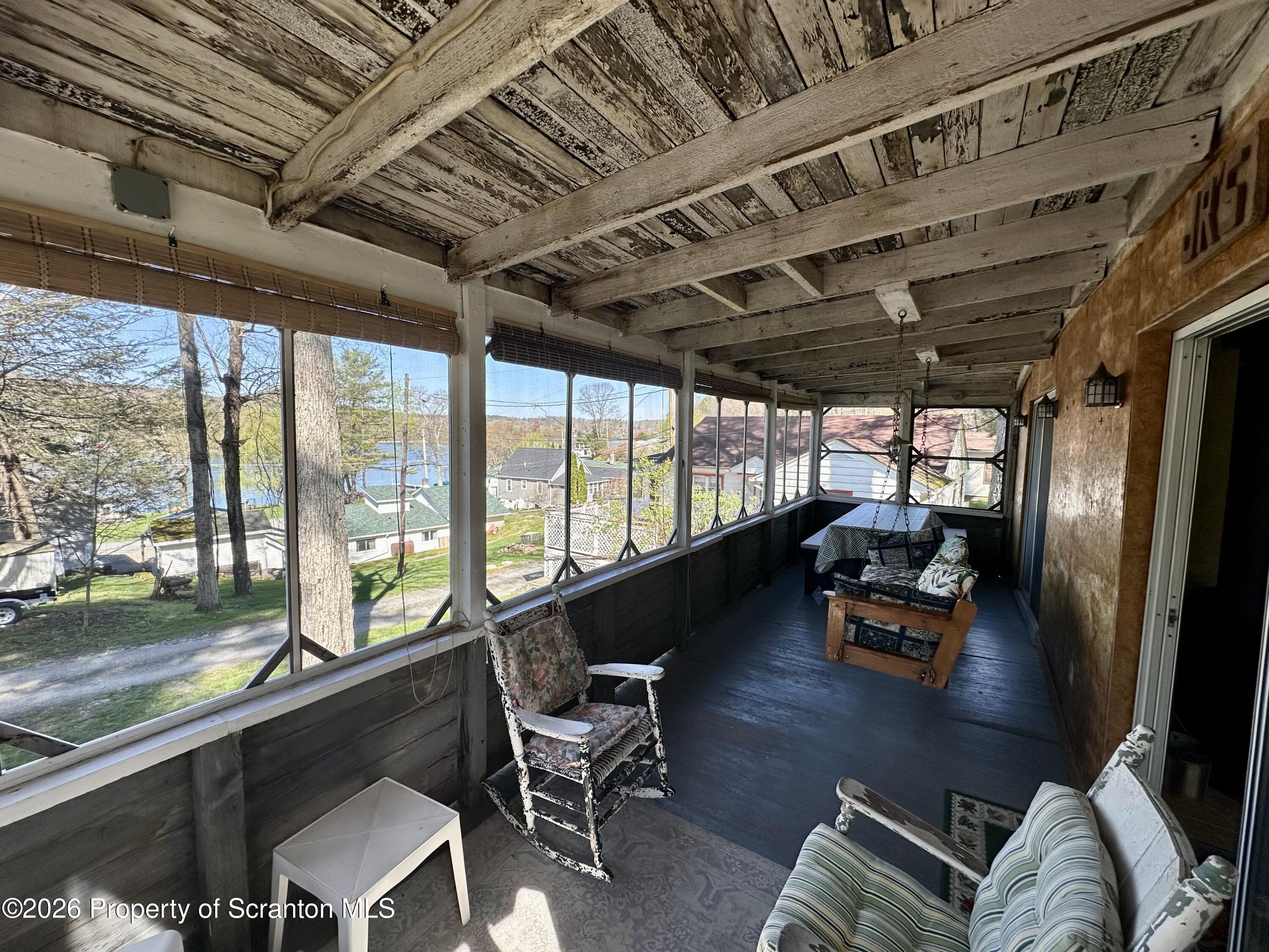 130 1st Street Tunkhannock, PA 18657 - Photo 4 of 23 a living room with furniture floor to ceiling window and wooden floor