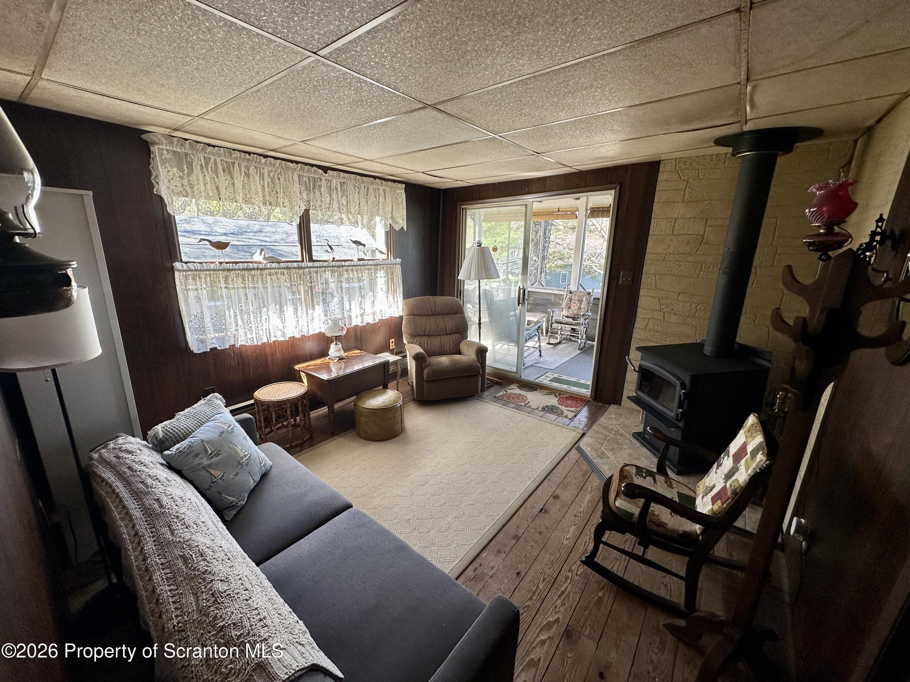 130 1st Street Tunkhannock, PA 18657 - Photo 8 of 23 a living room with furniture and a flat screen tv