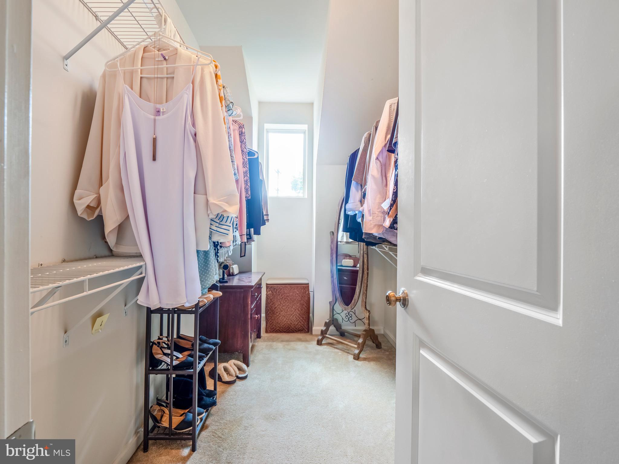 23366 Evening Primrose Square Brambleton, VA 20148 - Photo 16 of 28 a view of walk in closet with clothes and shoes