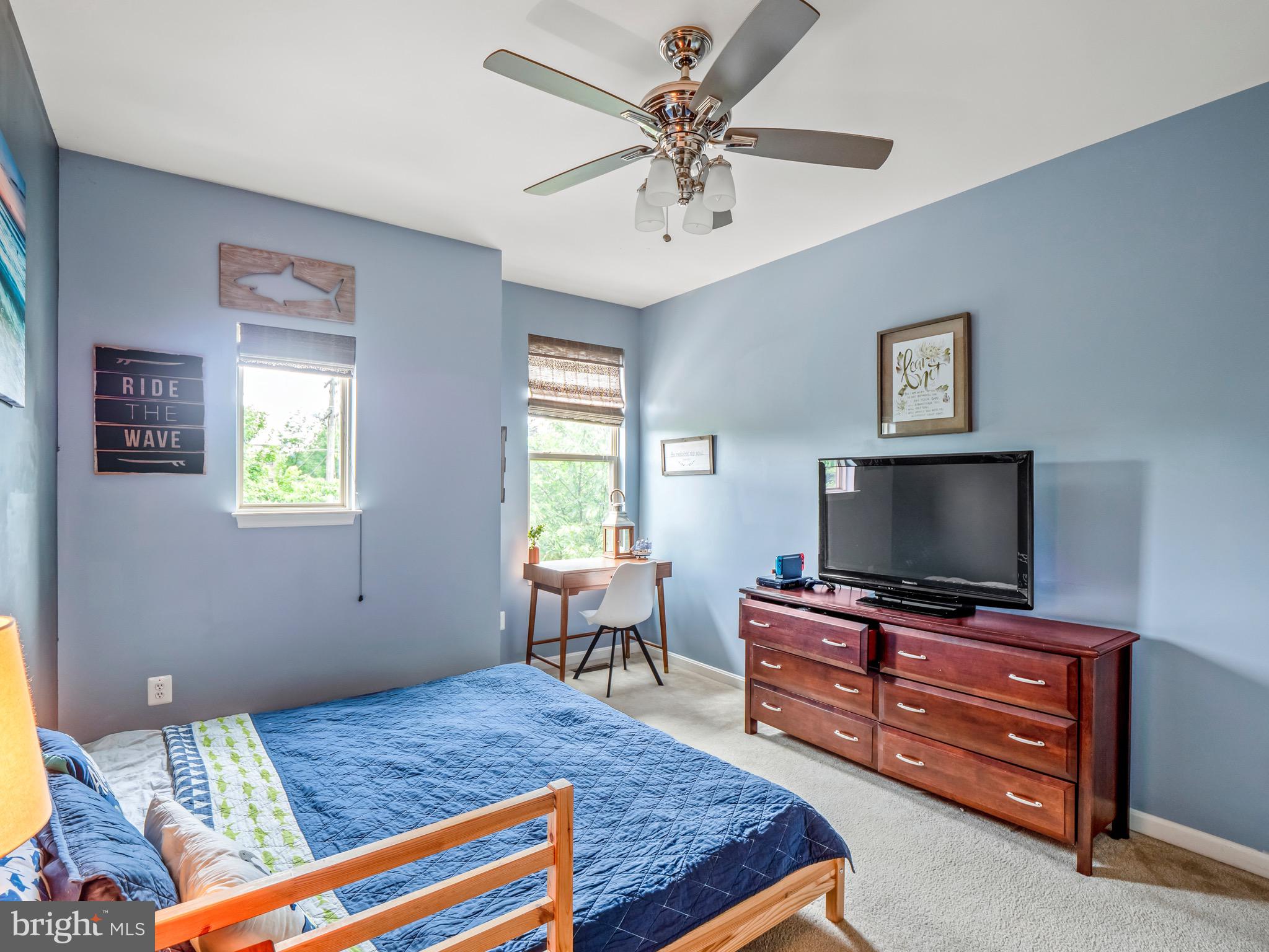 23366 Evening Primrose Square Brambleton, VA 20148 - Photo 22 of 28 a bedroom with a bed and furniture