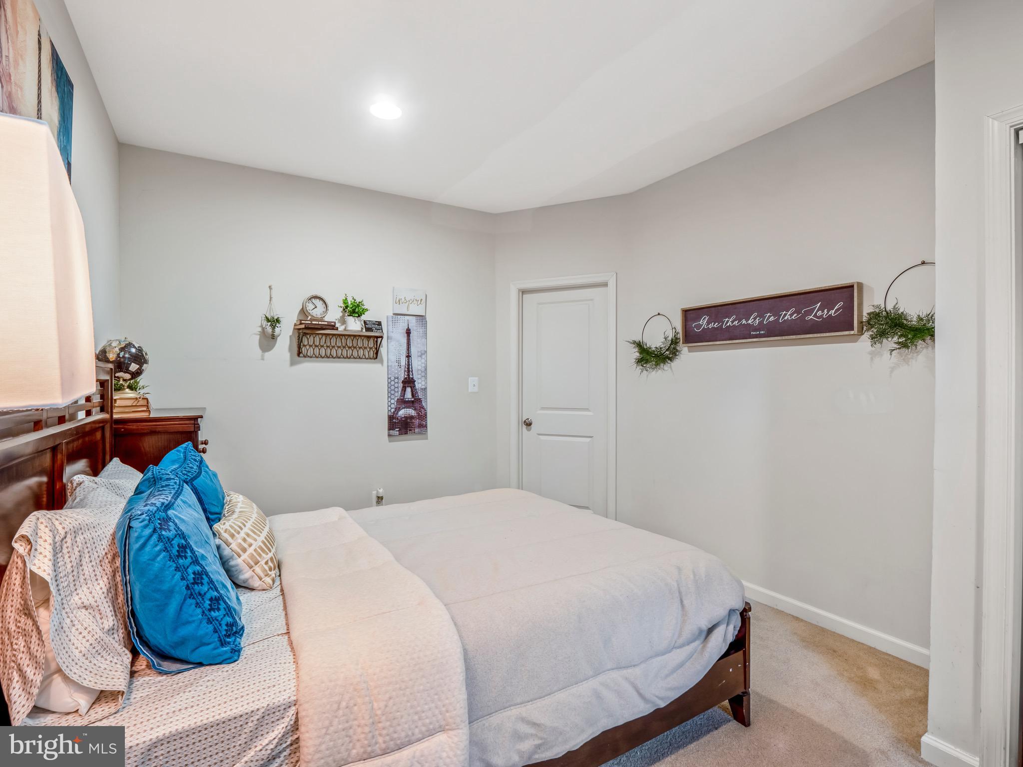 23366 Evening Primrose Square Brambleton, VA 20148 - Photo 26 of 28 a bedroom with a bed and hallway