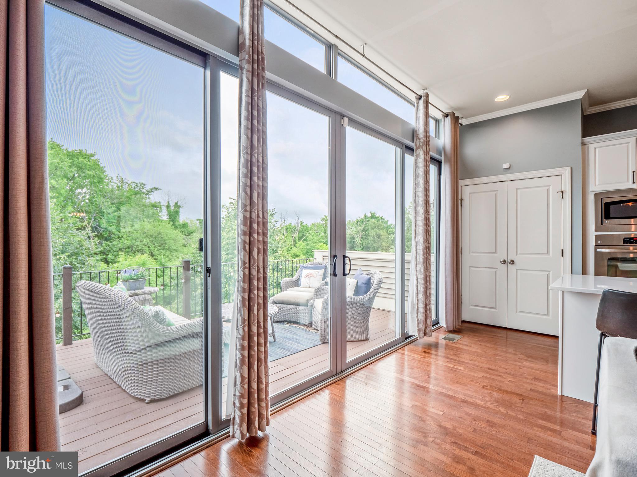 23366 Evening Primrose Square Brambleton, VA 20148 - Photo 9 of 28 a view of front door and porch with wooden floor