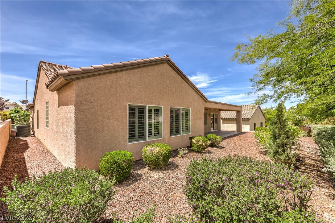 2276 Saxtons River Road Henderson, NV 89044 - Photo 32 of 49 Mature Low Maintenance Landscaping with Rock and Shrubs and Automatic Drip Irrigation System on Timer