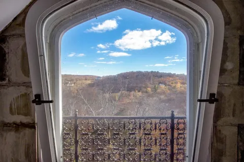 a view of balcony with furniture