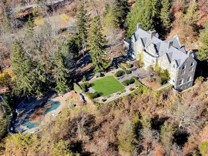 a view of outside plants and covered with trees