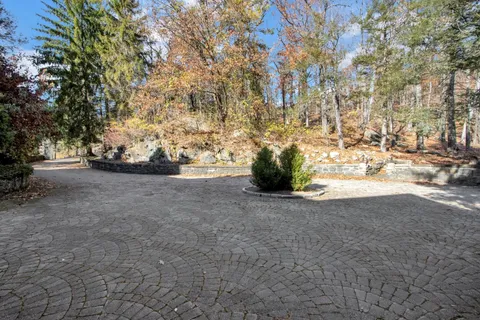 a view of a lake with a house swimming pool and outdoor space