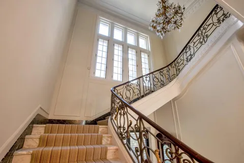a view of entryway with wooden floor and stairs