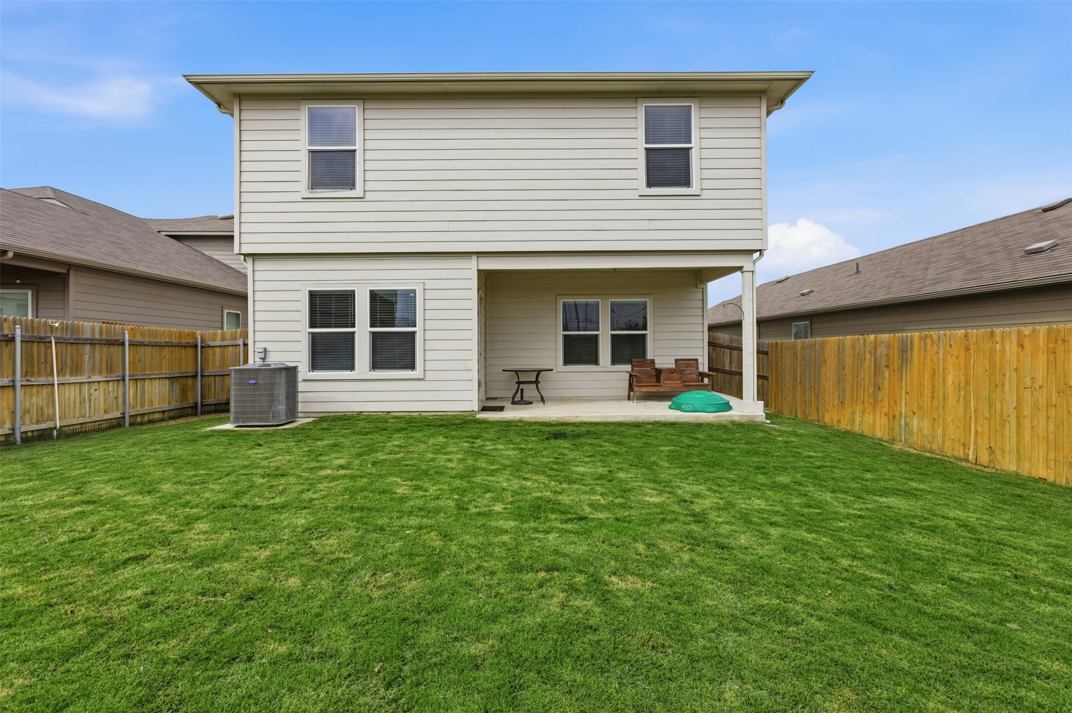 19017 Romano Drive Elgin, TX 78621 - Photo 32 of 33 Expansive green lawn providing ample outdoor space
