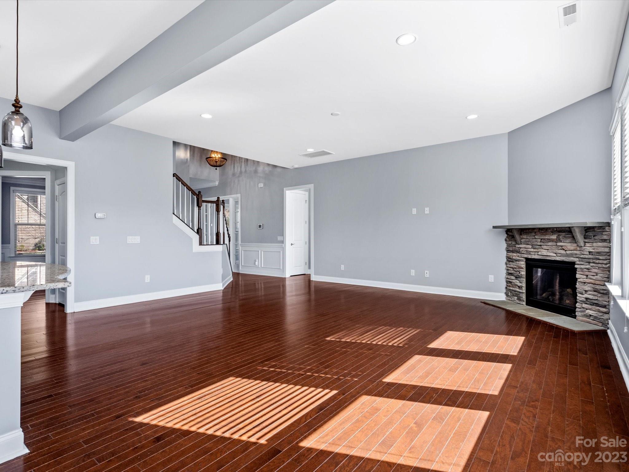7009 Fallondale Road Waxhaw, NC 28173 - Photo 12 of 47 a view of a livingroom with wooden floor and a fireplace