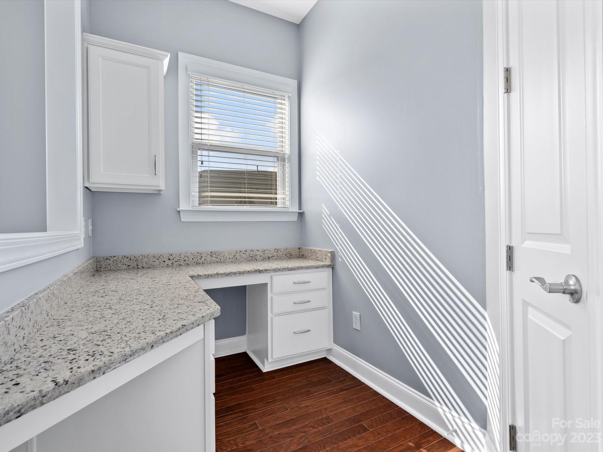 7009 Fallondale Road Waxhaw, NC 28173 - Photo 15 of 47 a kitchen with a sink cabinets and wooden floor