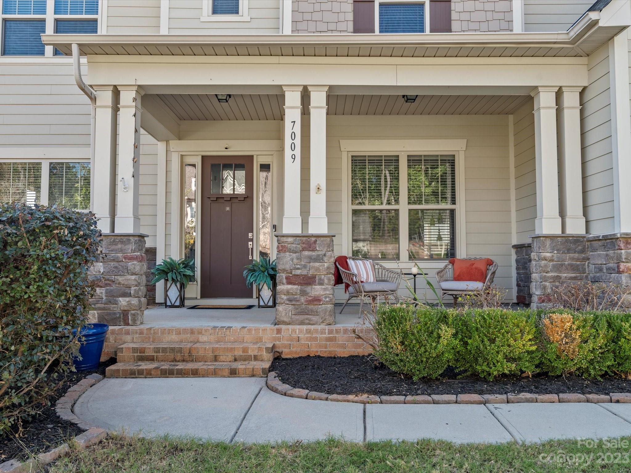7009 Fallondale Road Waxhaw, NC 28173 - Photo 2 of 47 a front view of a house with lots of green space