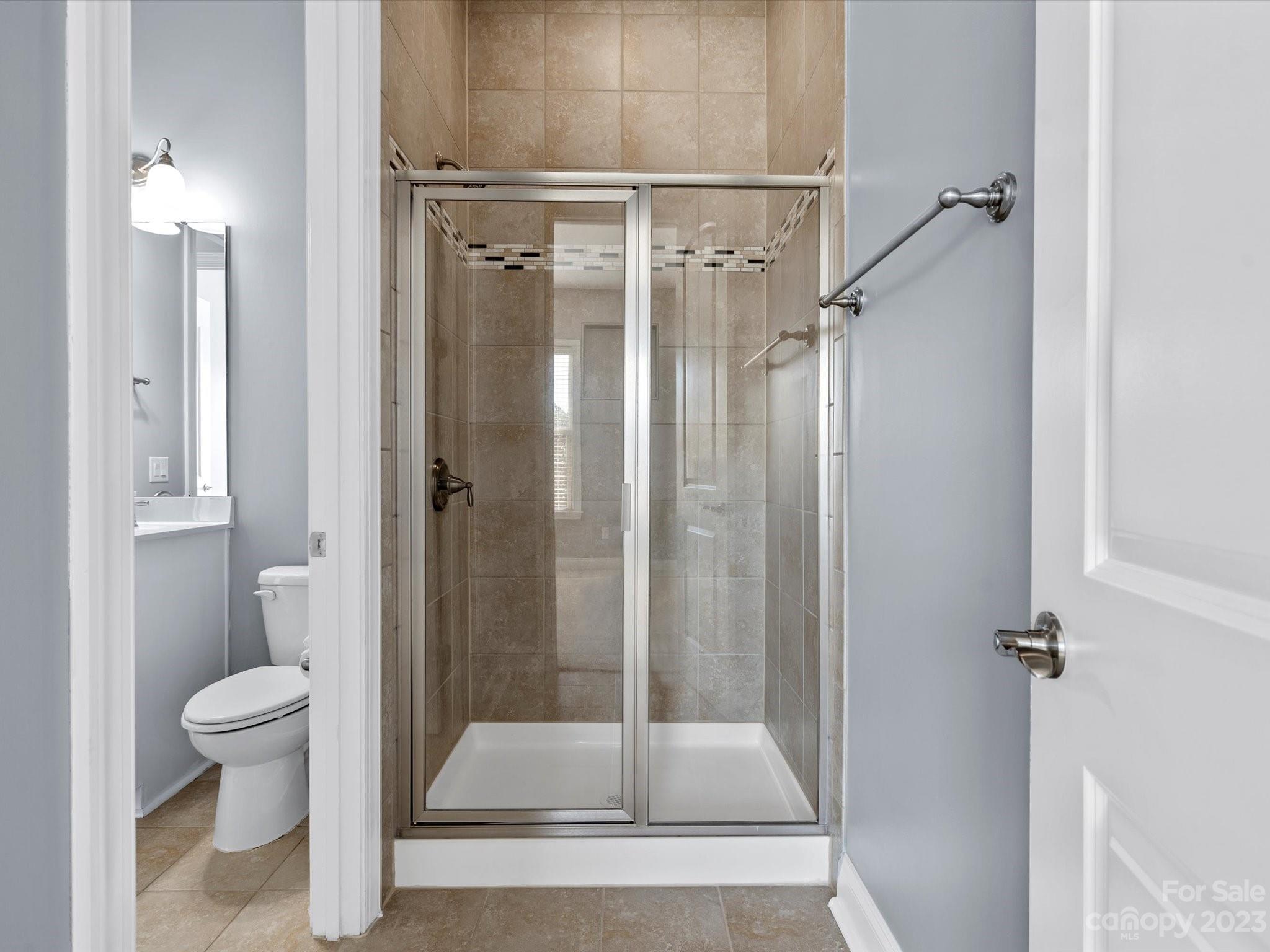 7009 Fallondale Road Waxhaw, NC 28173 - Photo 26 of 47 a bathroom with a shower and toilet