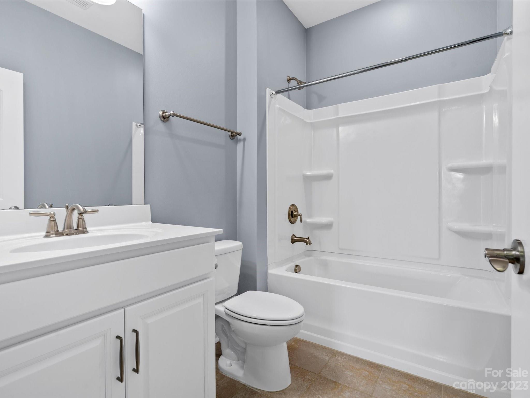 7009 Fallondale Road Waxhaw, NC 28173 - Photo 28 of 47 a bathroom with a sink a toilet and a bathtub